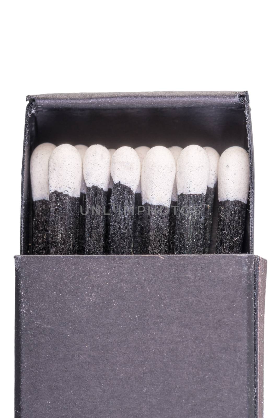 Black matches in a box on a white background macro by kosmsos111