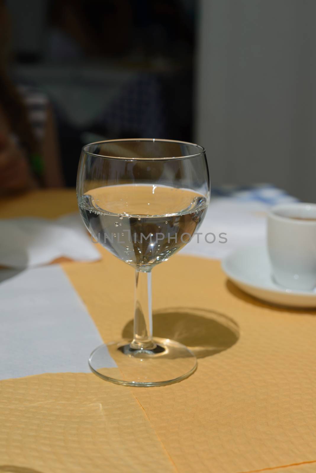 Sparkling water in glass on the table by anytka
