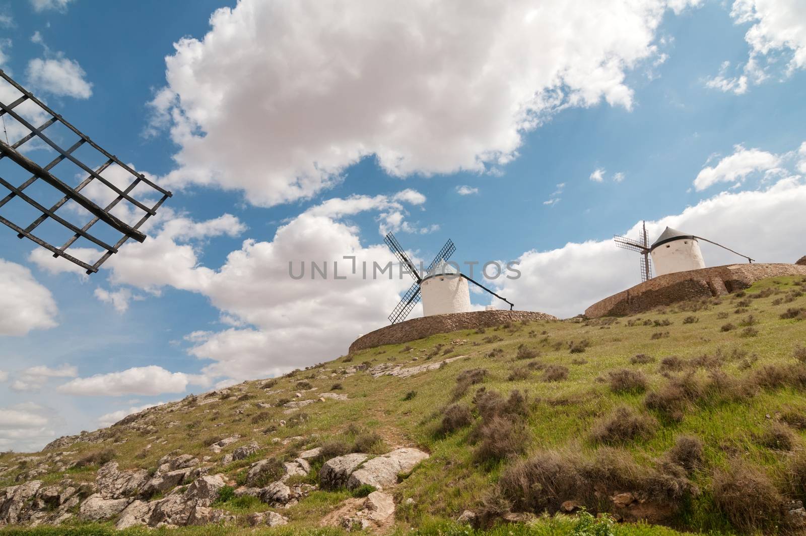 Old windmills on the hill, sky with clouds
