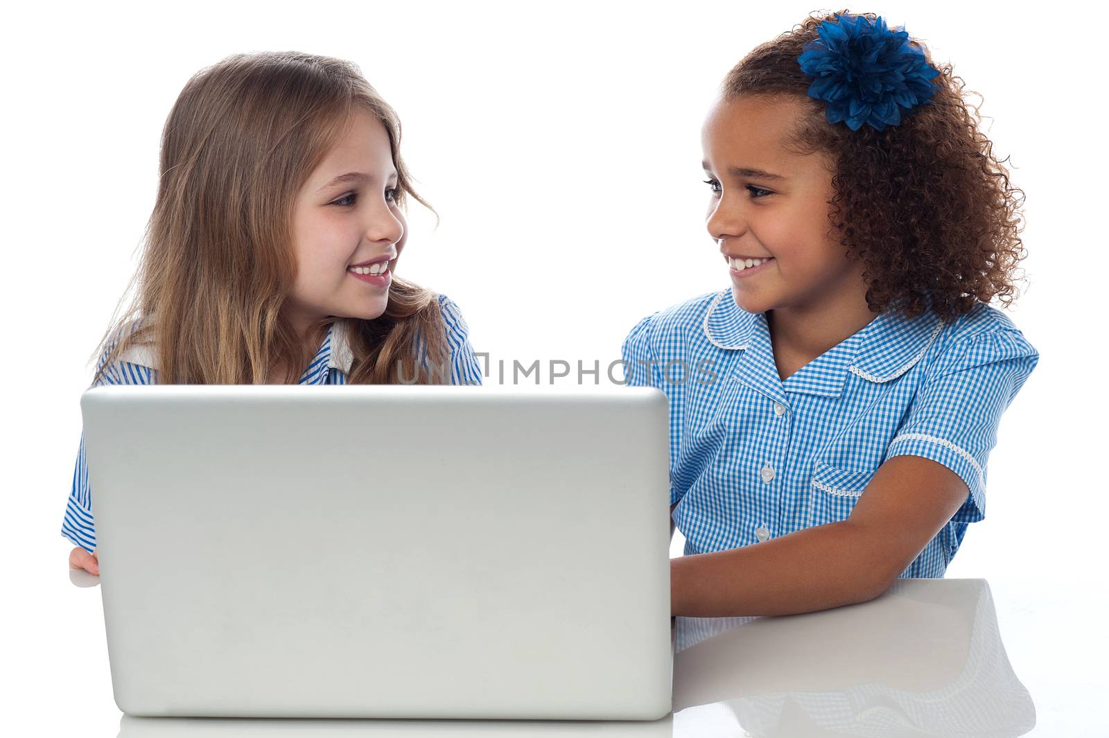 Little girls learning in laptop by stockyimages