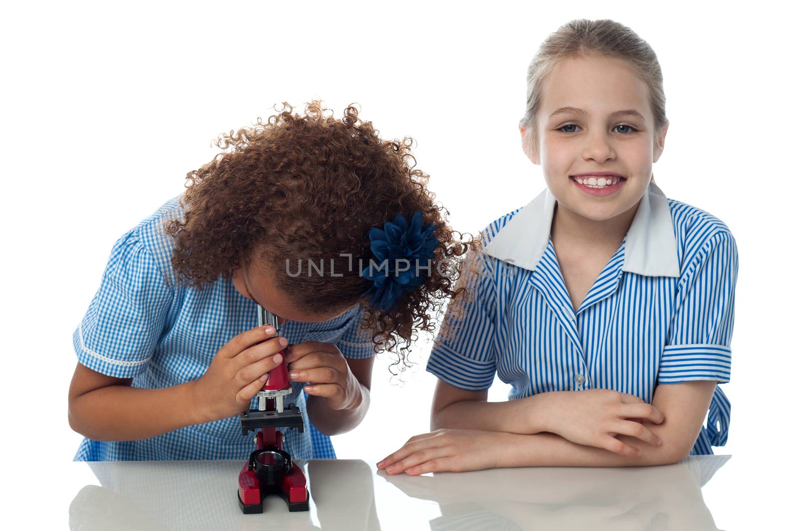 Two school kids doing research by stockyimages