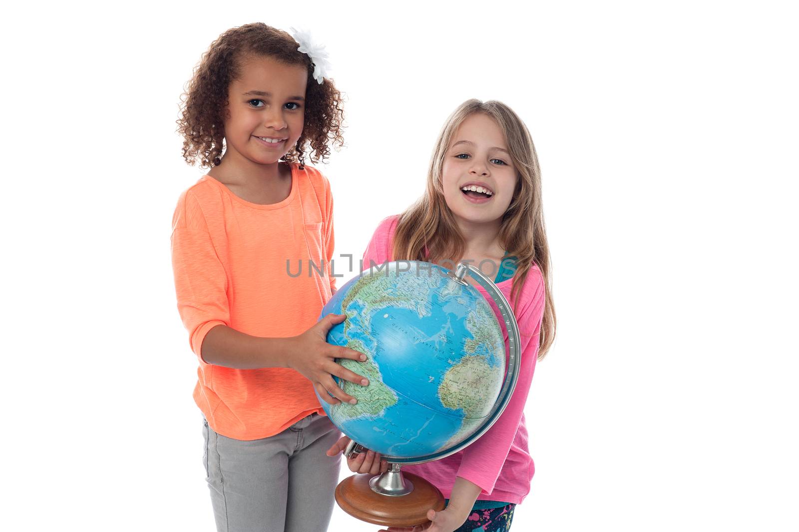 School girls locating countries on globe