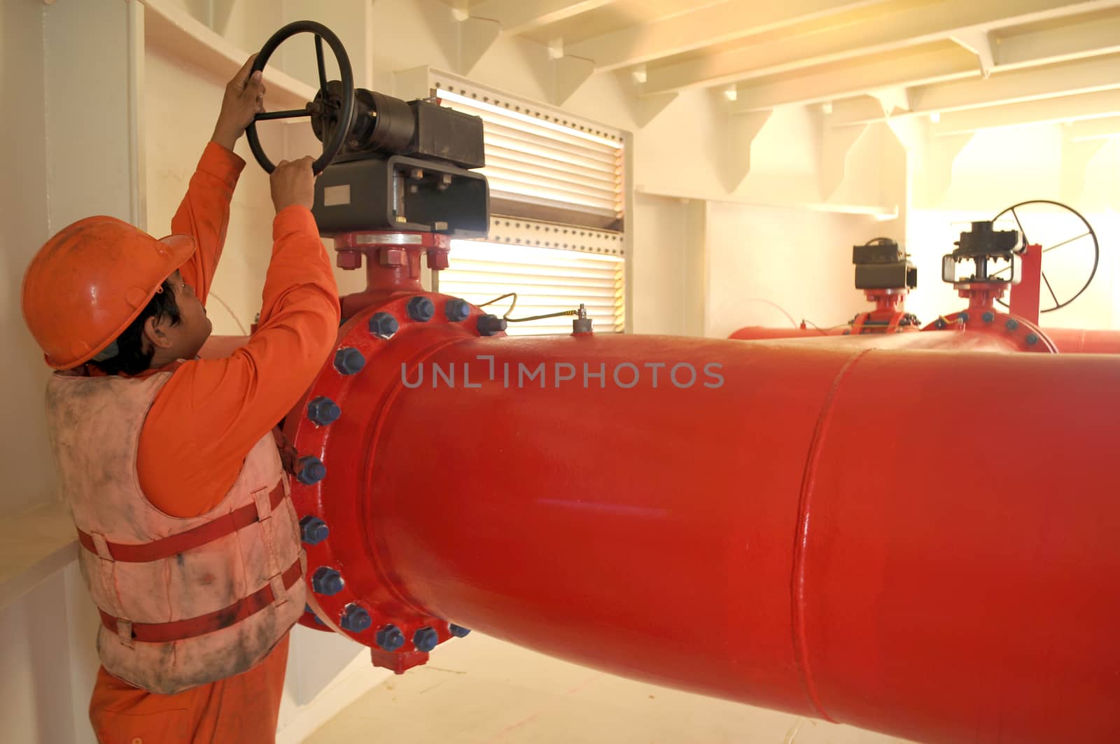 A worker on duyty in Oil and gas transfer platforms by think4photop