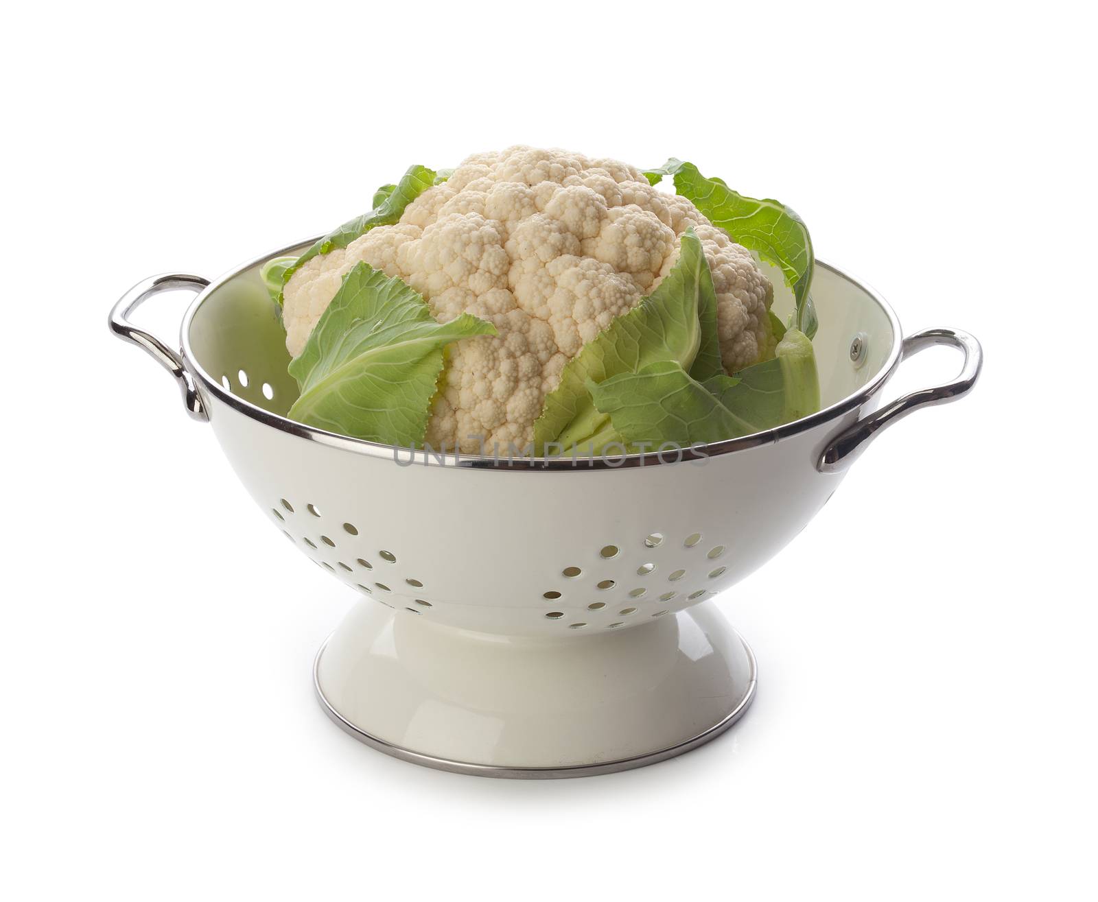 Head of cauliflower in the white metal collander