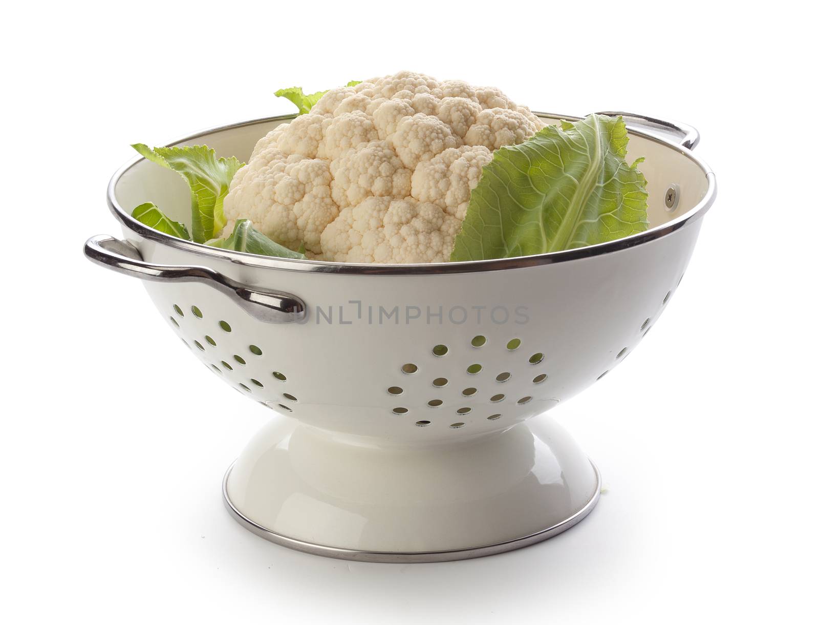 Head of cauliflower in the white metal collander