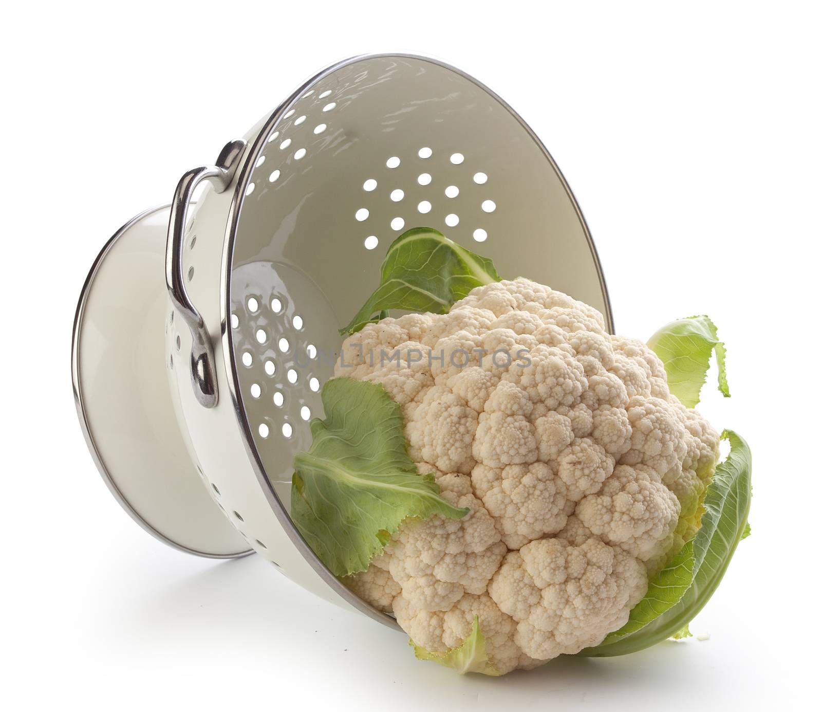 Head of cauliflower in the white metal collander