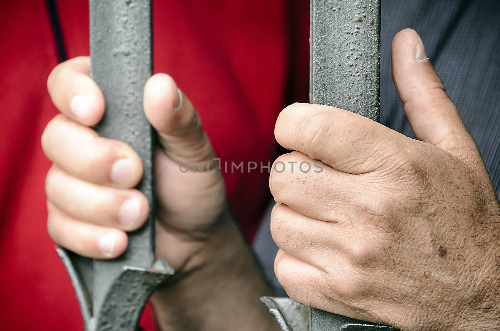 Workers barricaded behind bars for protesting the poor working conditions.
