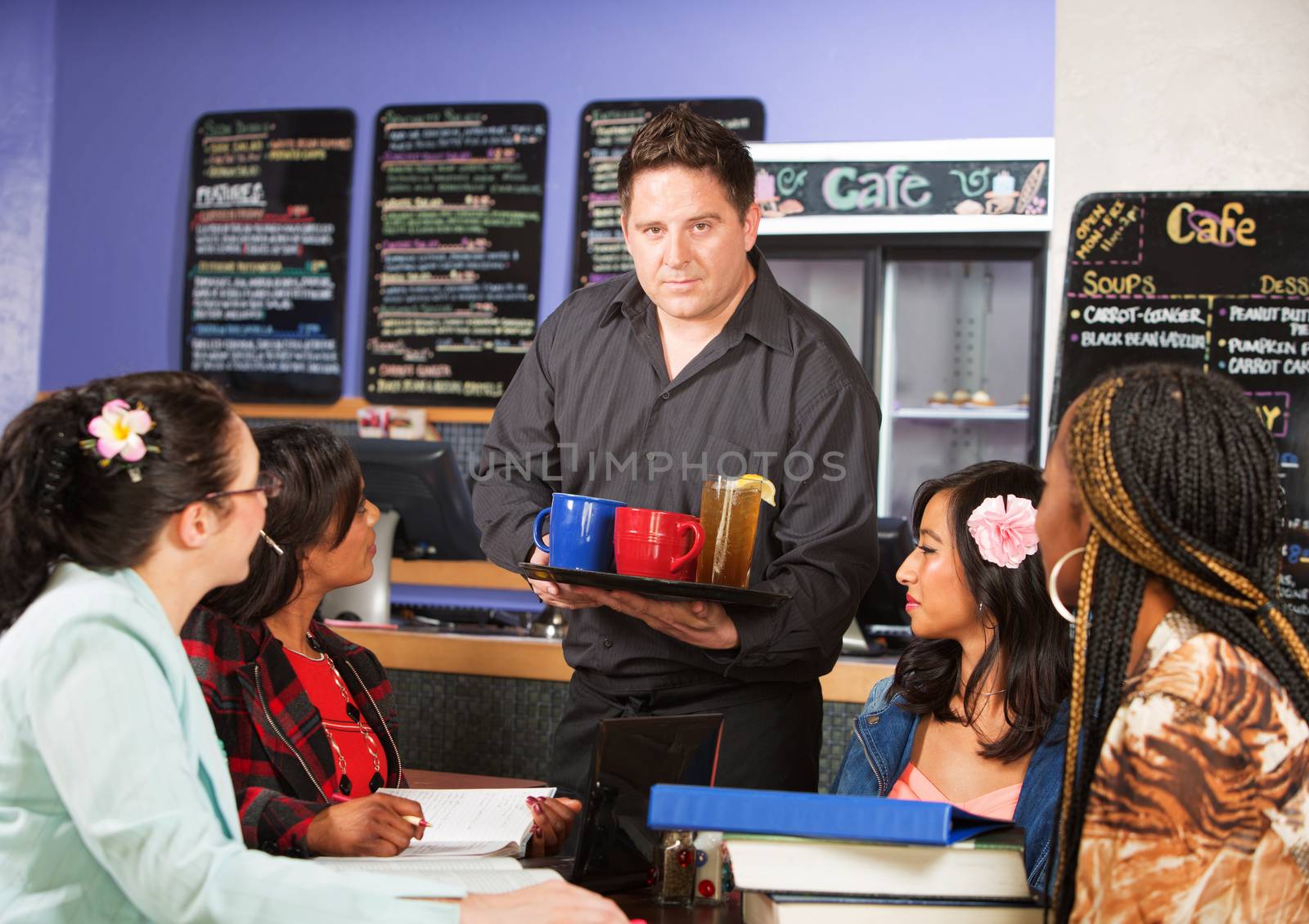 Coffee house server with drinks on tray for customers