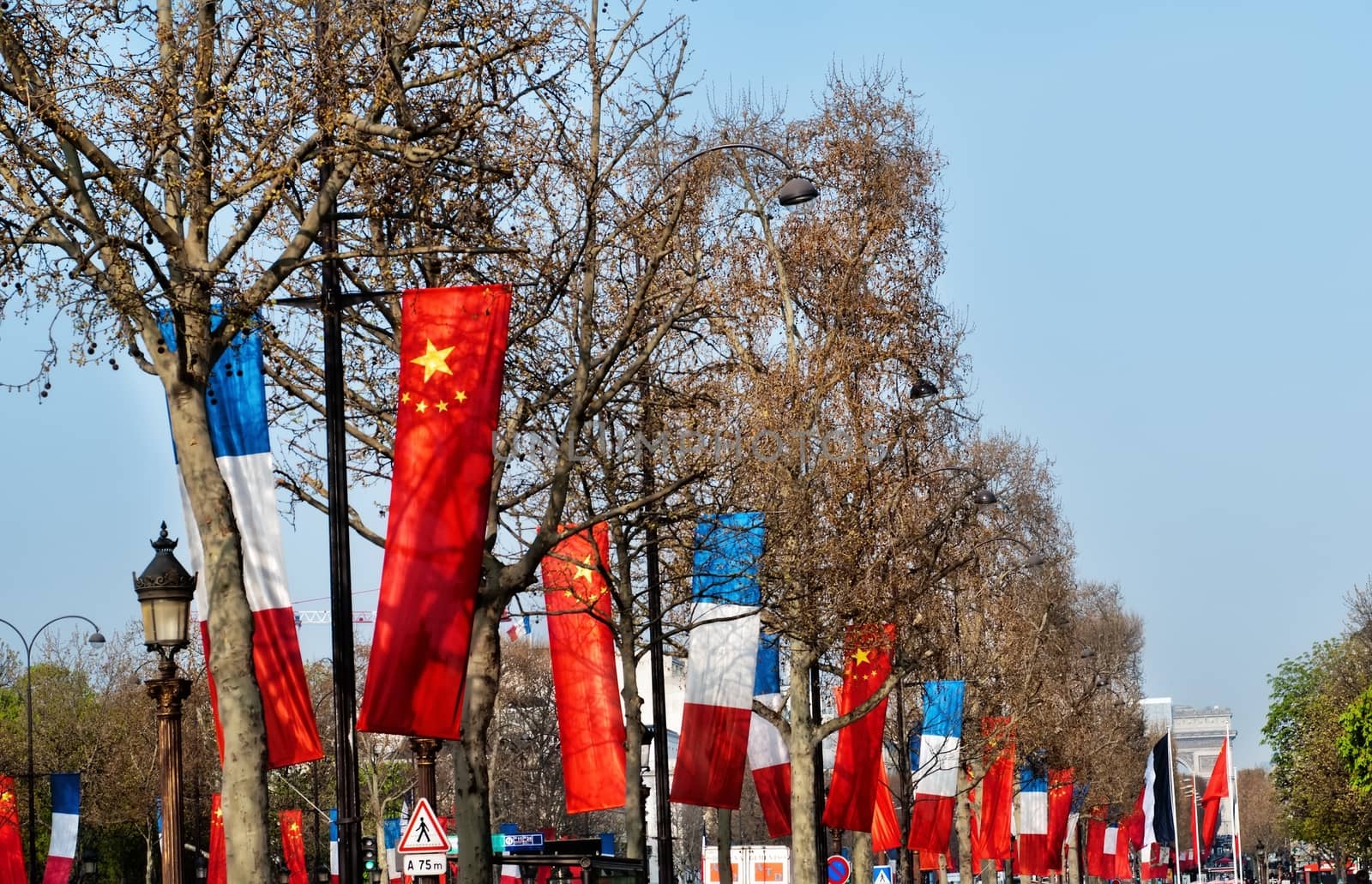 Flags on Champs-Elysees in Paris. by mitakag