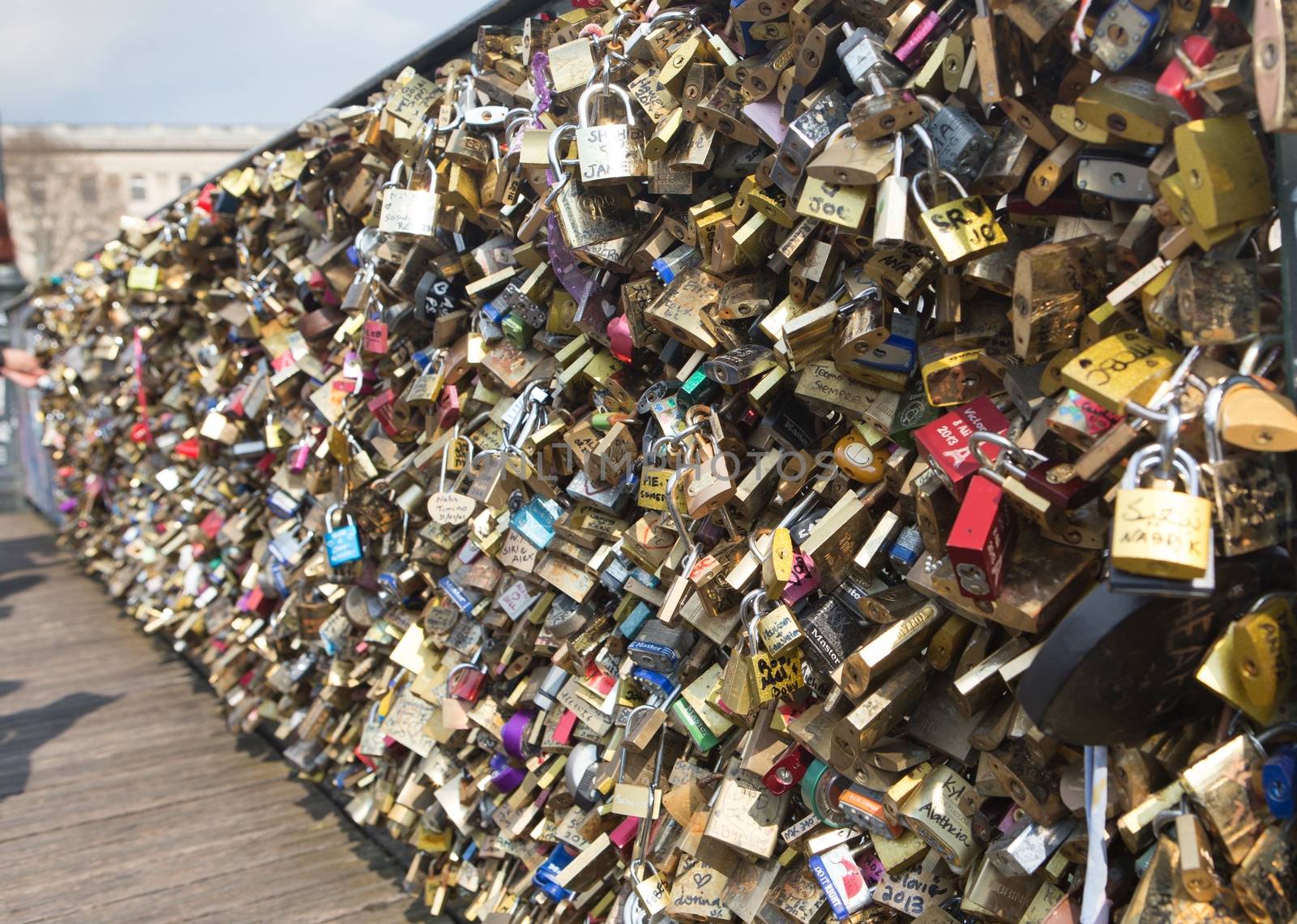 Love padlocks on Bridge of arts in Paris, France