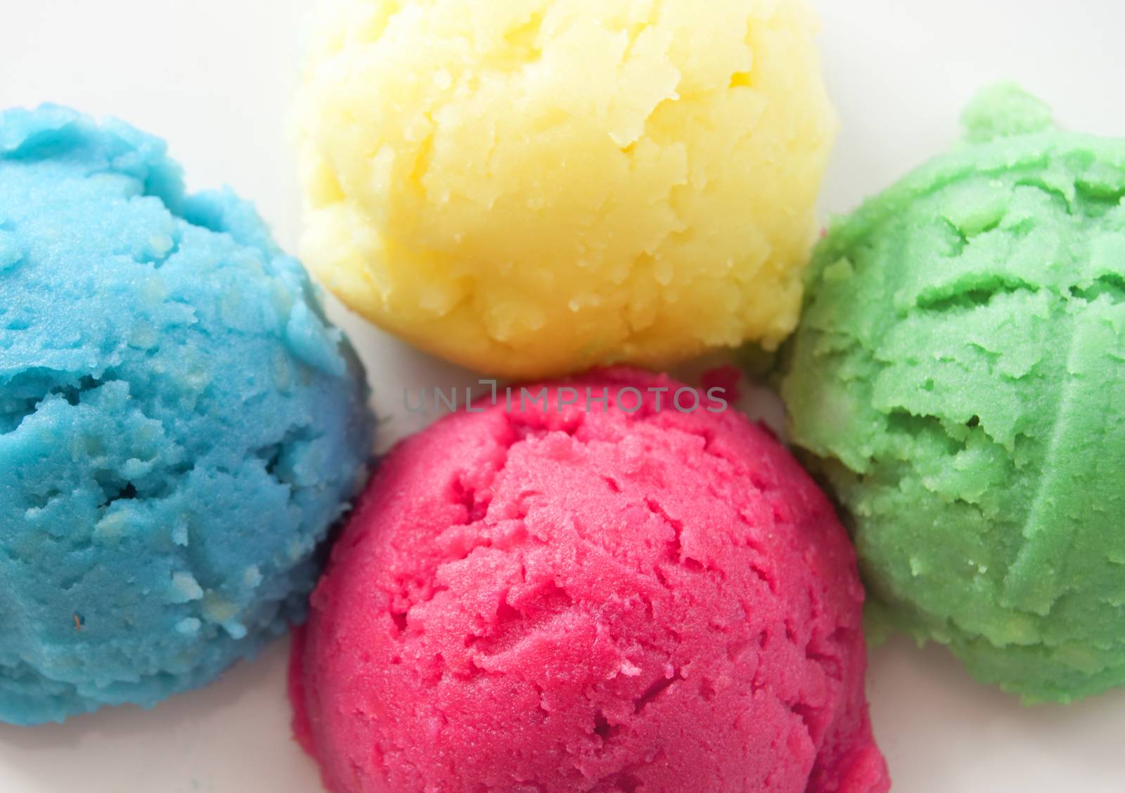 Different flavored yogurt ice cream scoops