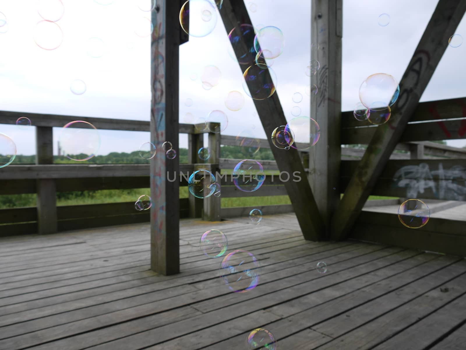 Soap bubble in the wooden tower near the sea side