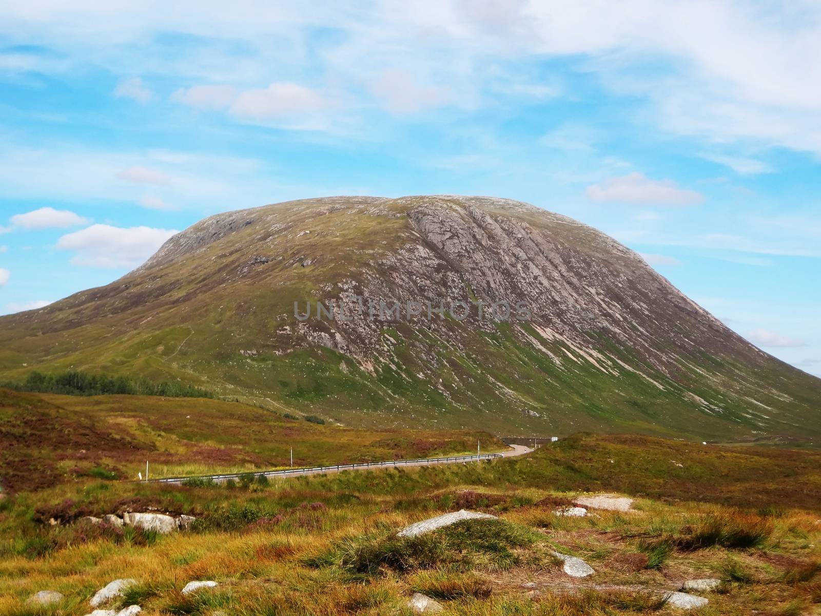 Scottish Highlands, mountain valley with blue sky