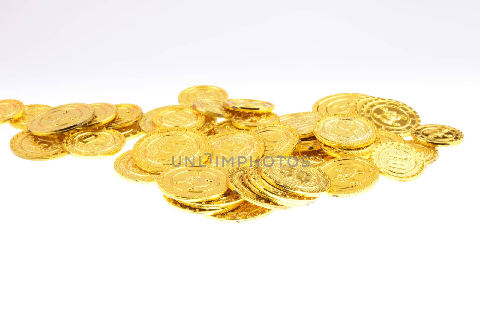 Pile of gold coins on a white background