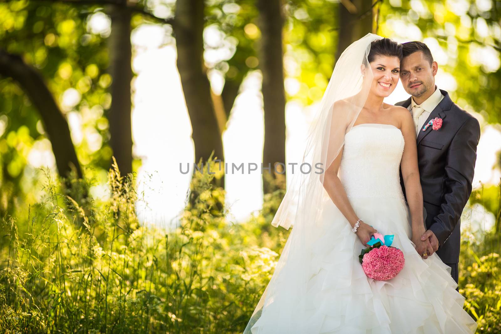 Portrait of a young wedding couple on their wedding day by viktor_cap