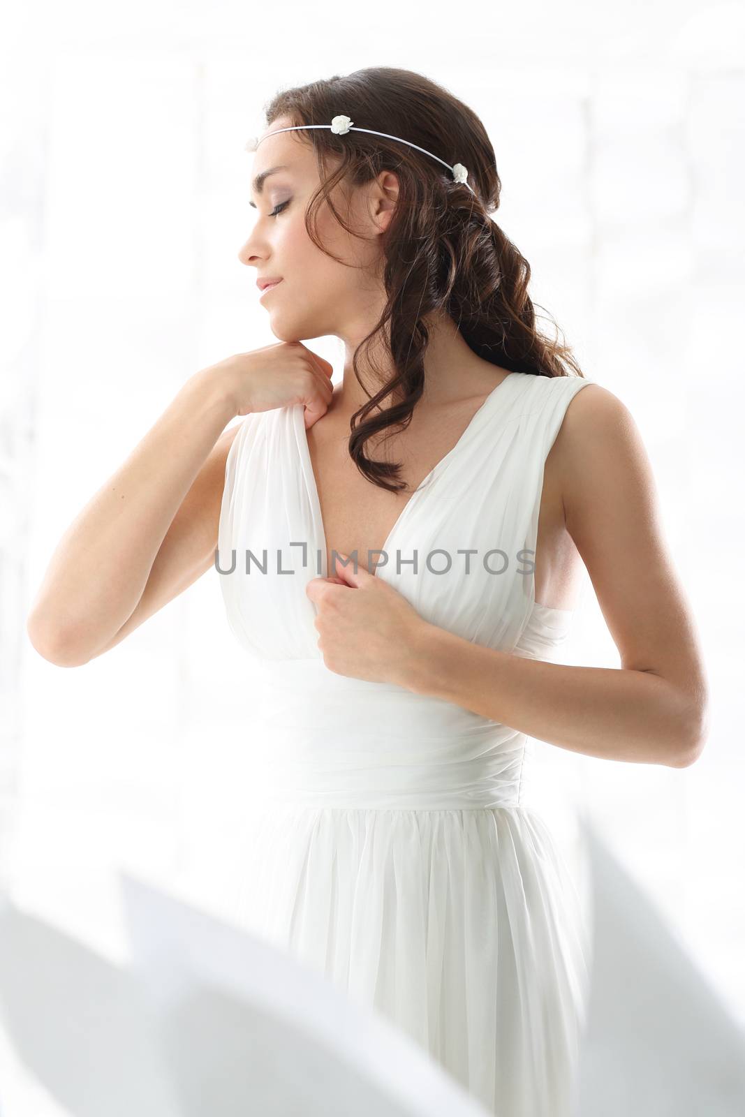 Bride in a white dress in a romantic scenery