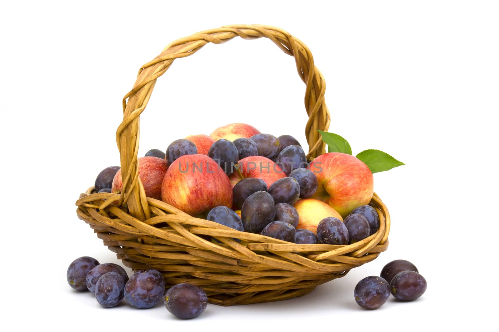 fresh fruits in a basket on white background