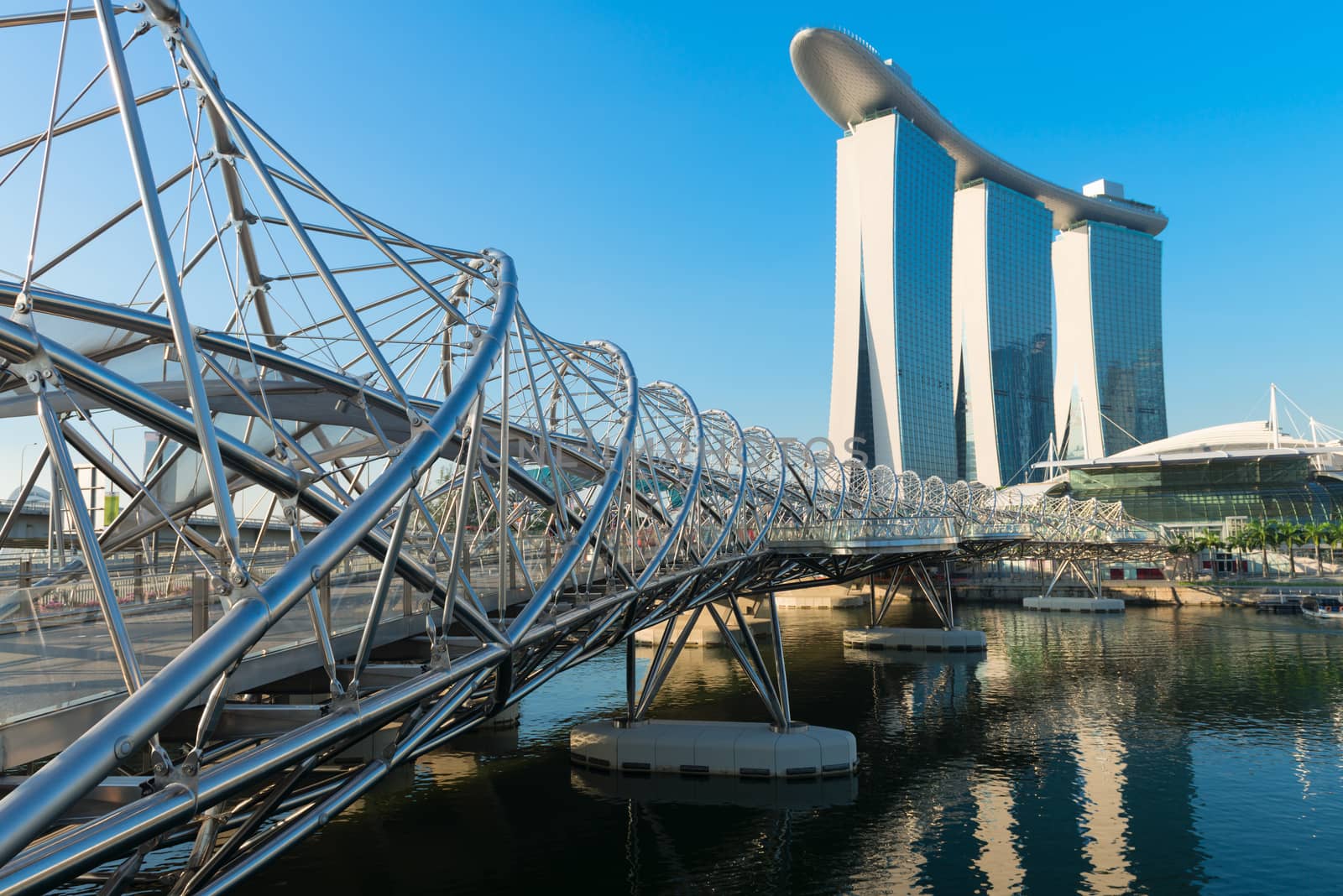 SINGAPORE - JUNE 01, 2013: Marina Bay Sands, an integrated resort and shopping mall with modern Helix bridge on front. 