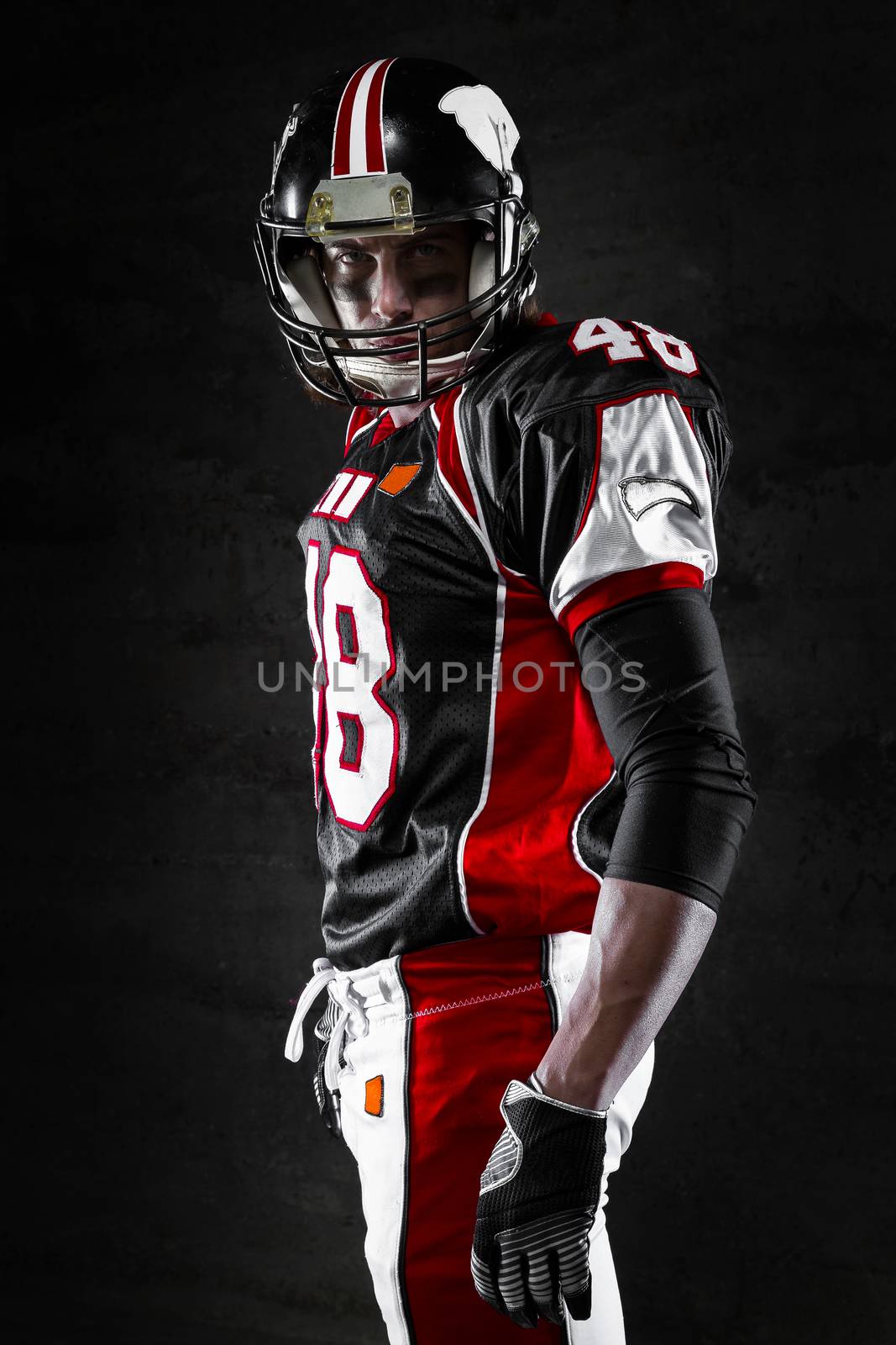 american football player on dark background by alessandroguerriero