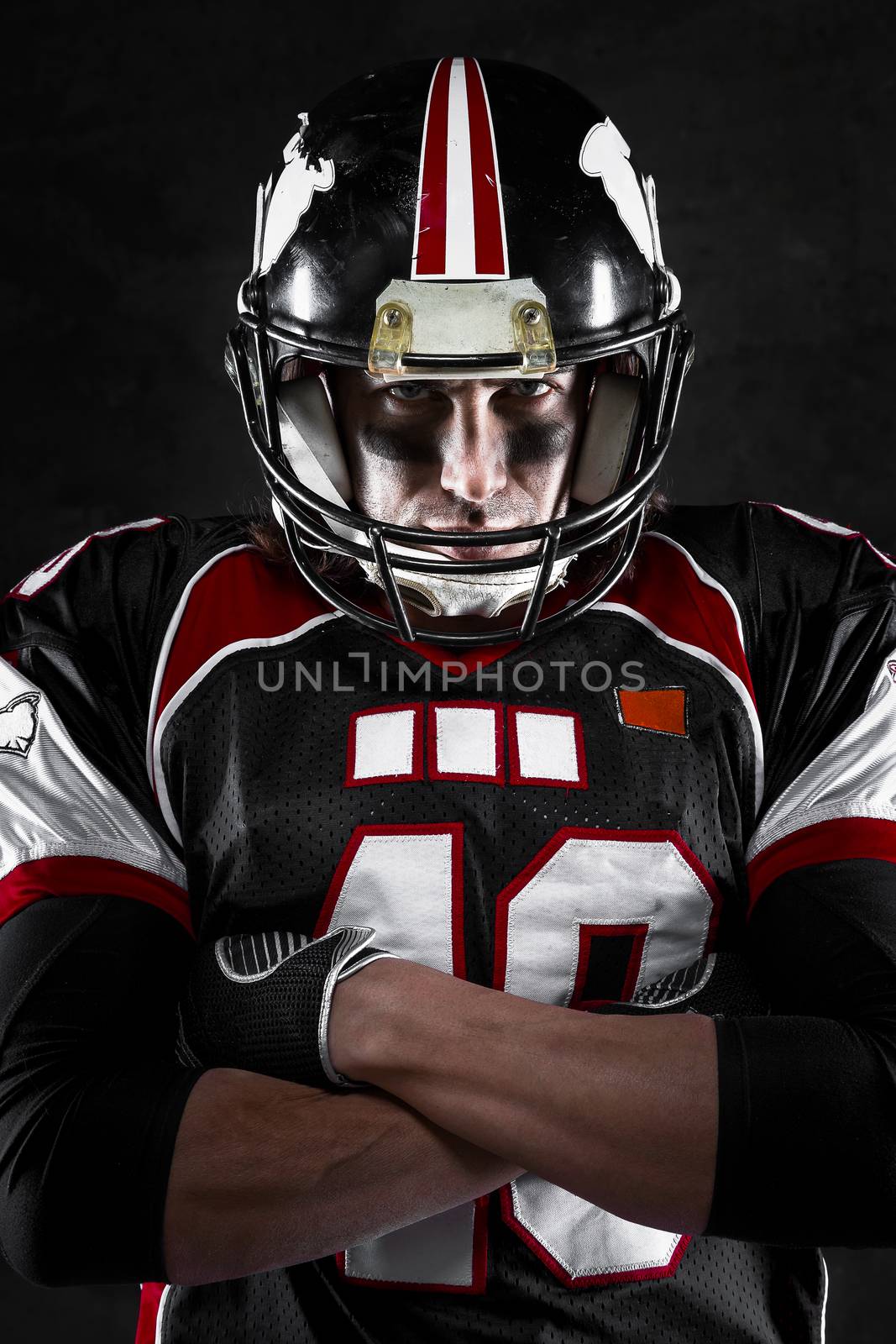 Portrait of american football player with intense gaze