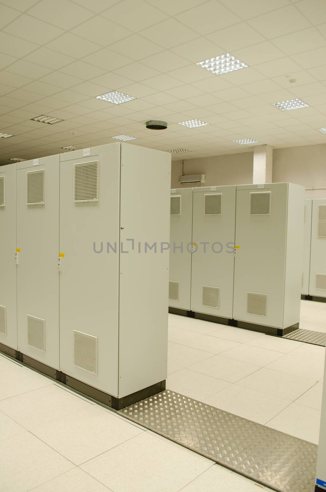 Powerful servers computers placed in special cabinets stored in scientific research center.