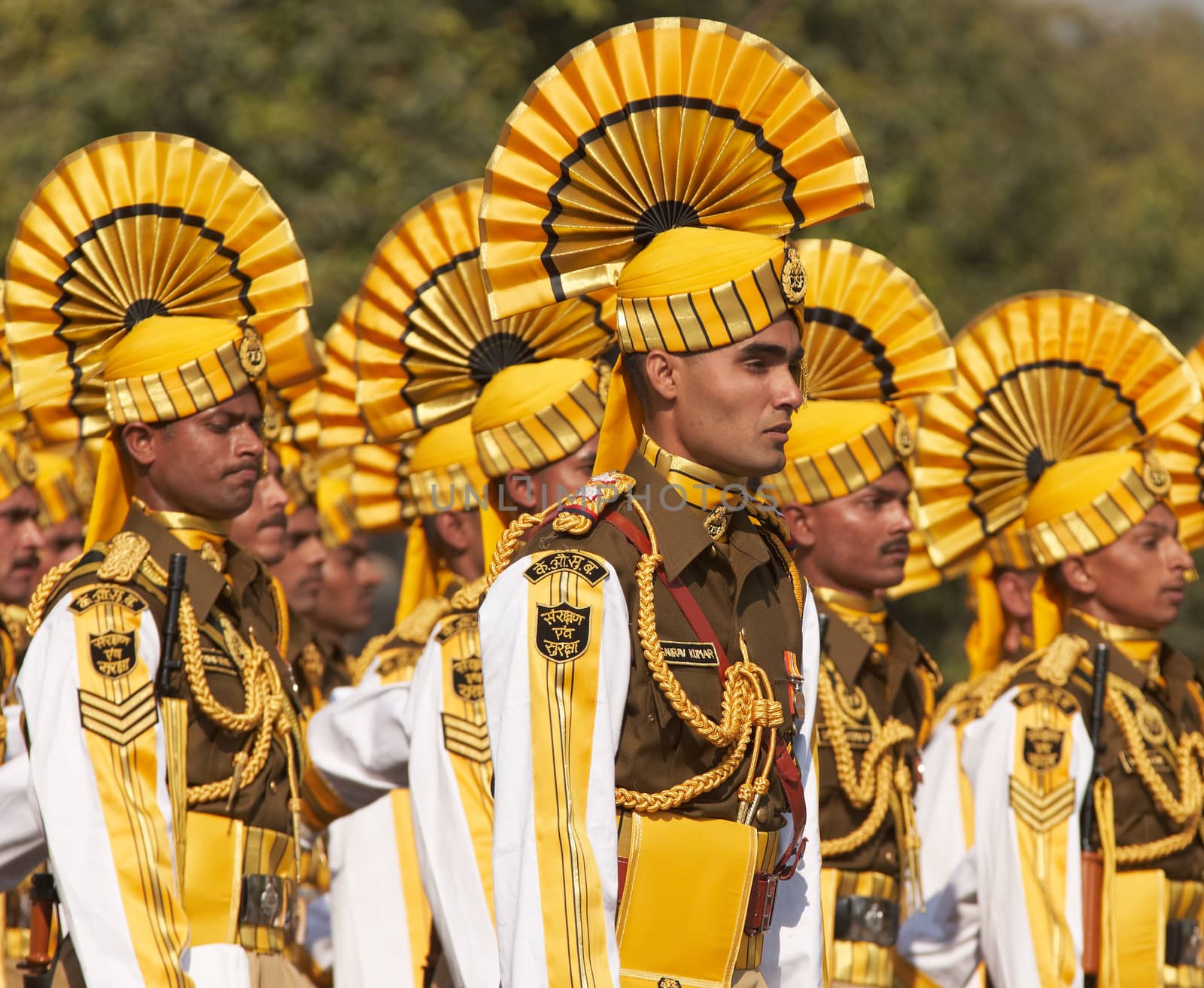 Soldiers in bright yellow trimmed uniform parading down the Raj Path in preparation for the annual Republic Day Parade in New Delhi, India