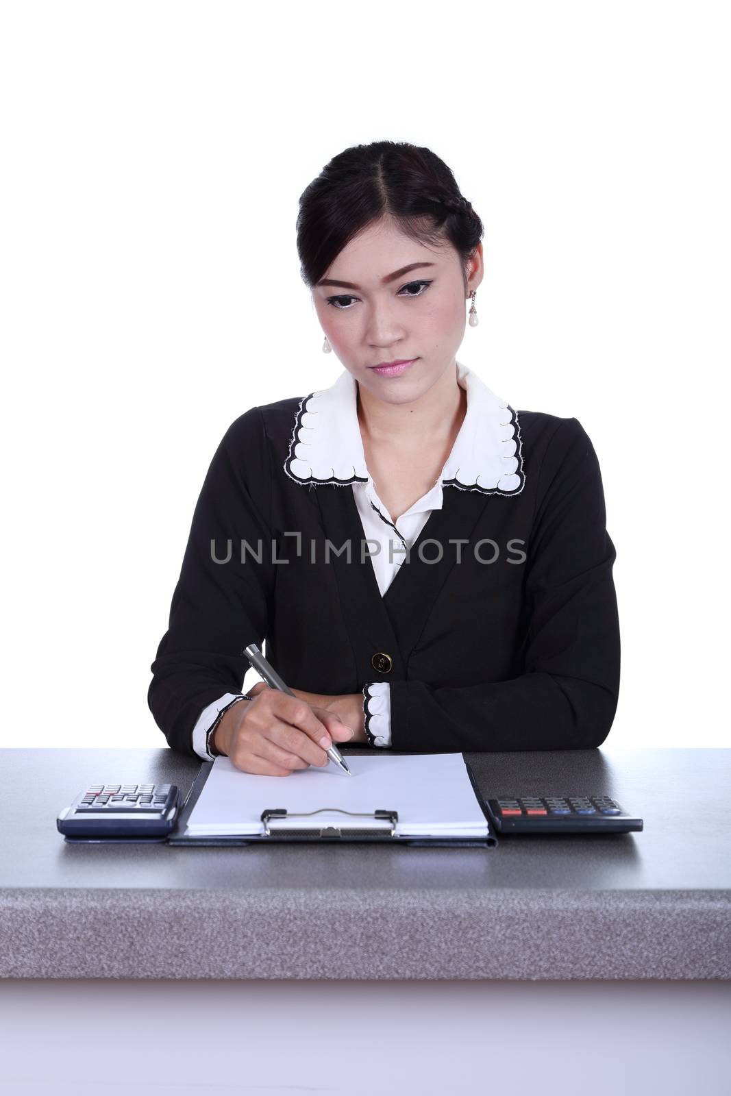 business woman sitting on her desk holding a pen working with documents sign up contract isolated on white background