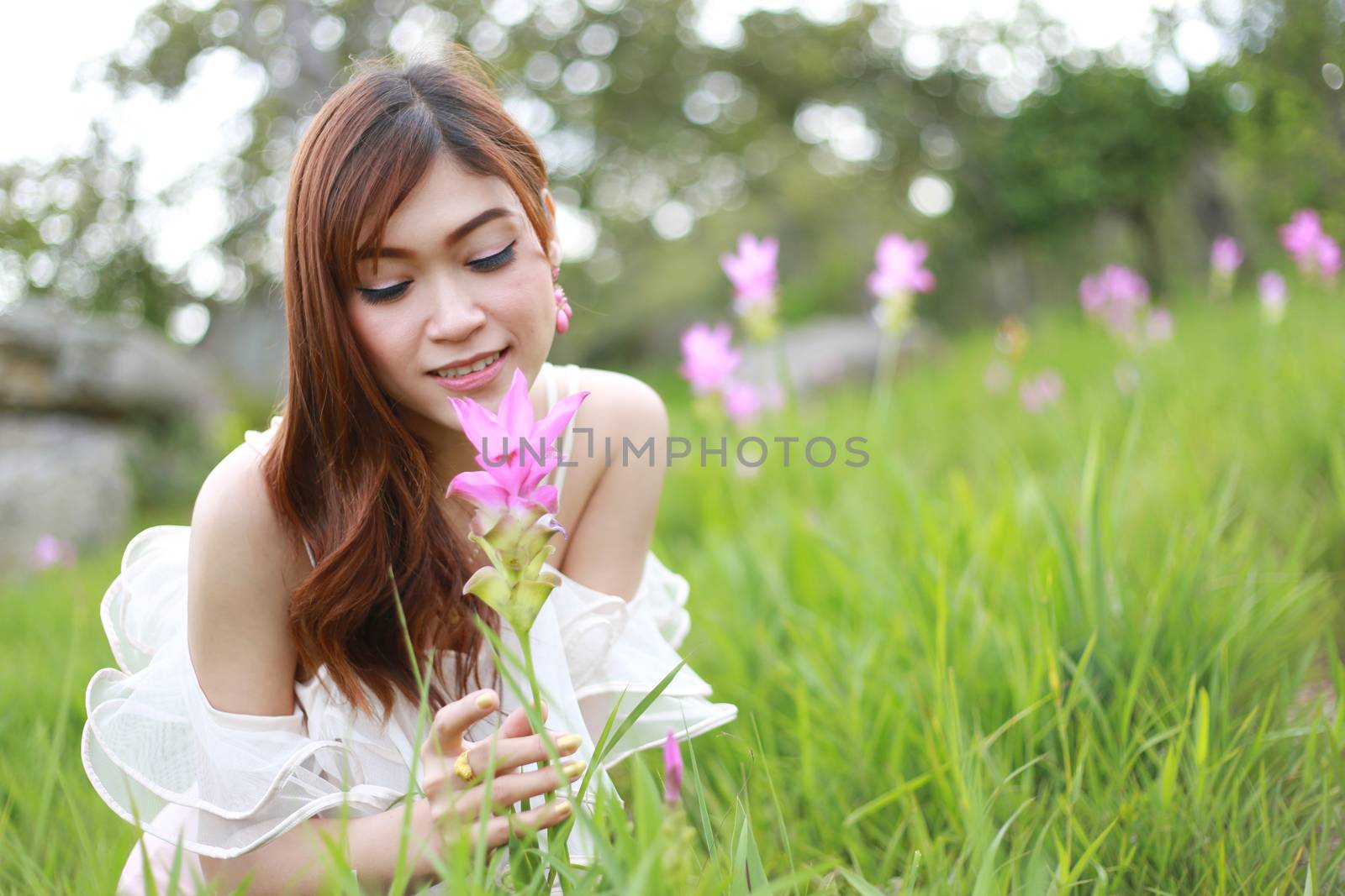 pretty asian woman in siam tulip flower field by geargodz