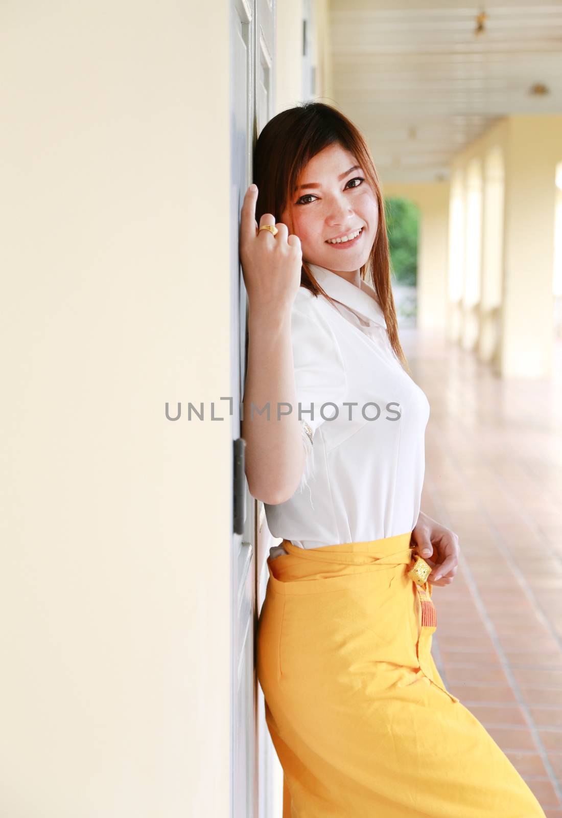 portrait woman smiles in traditional house