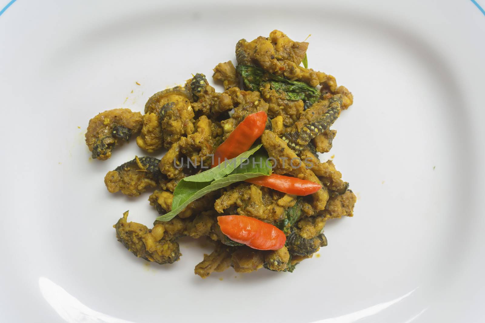 Stir spicy fried bengal monitor on dish