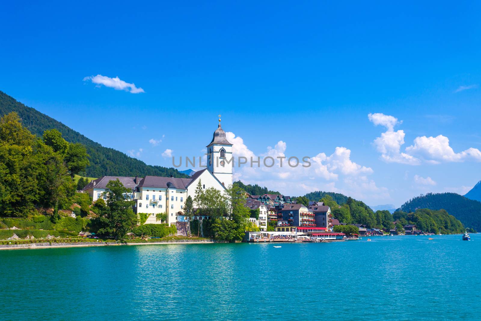 View of View of St. Wolfgang chapel and the village waterfront at Wolfgangsee lake, Austria