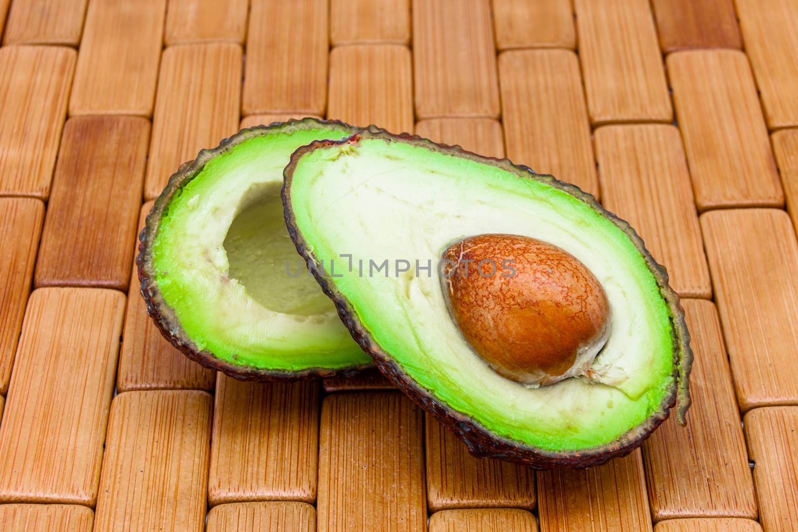 Composition of an avocado on a wood background