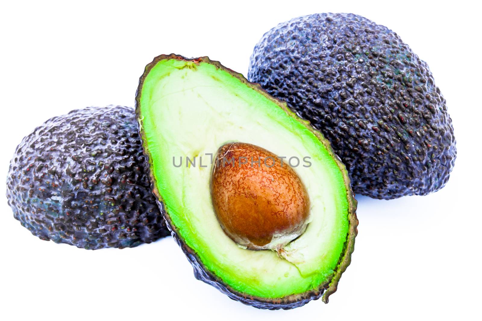 Composition of several avocados on a white background