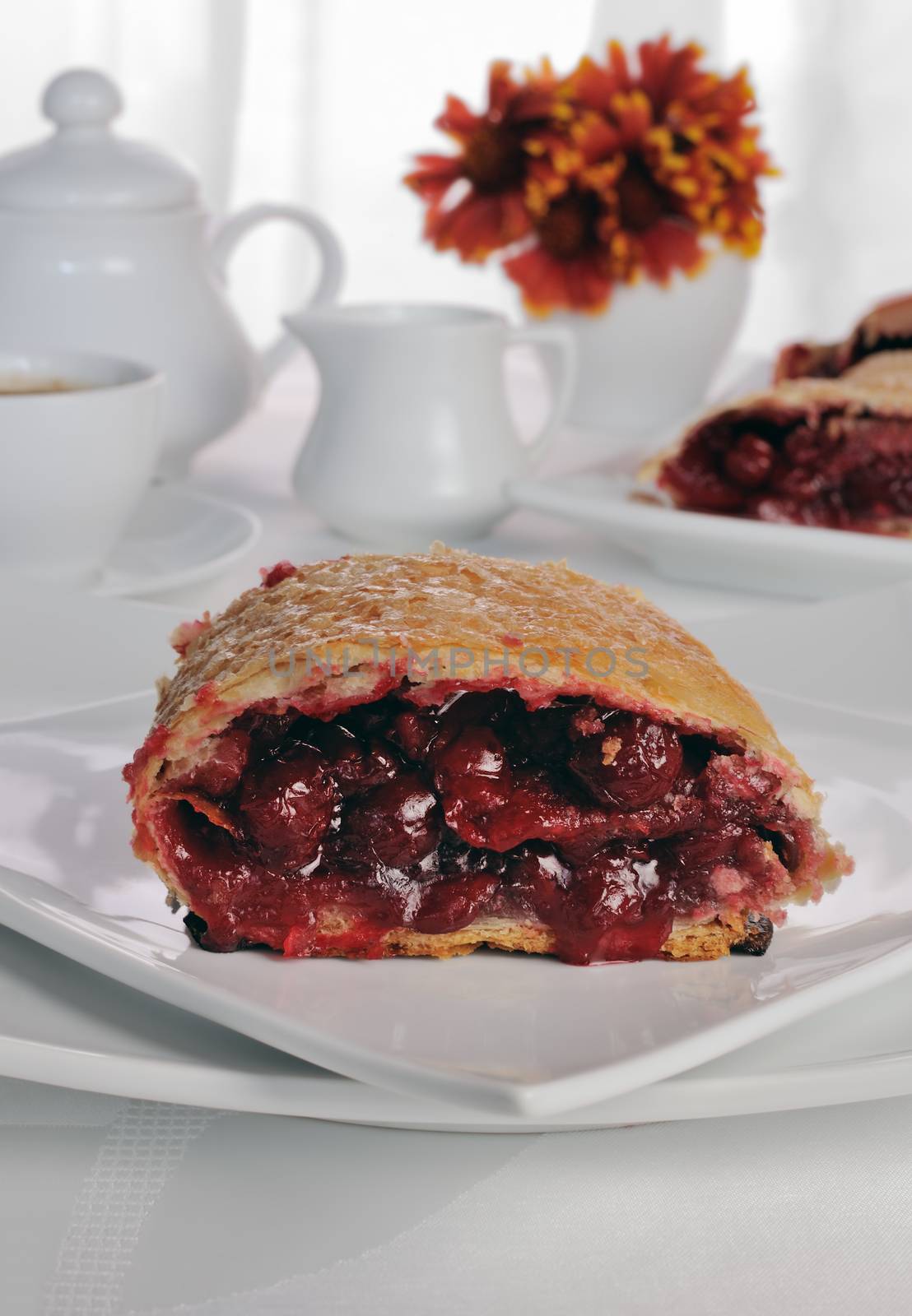 Piece of cherry strudel on the coffee table