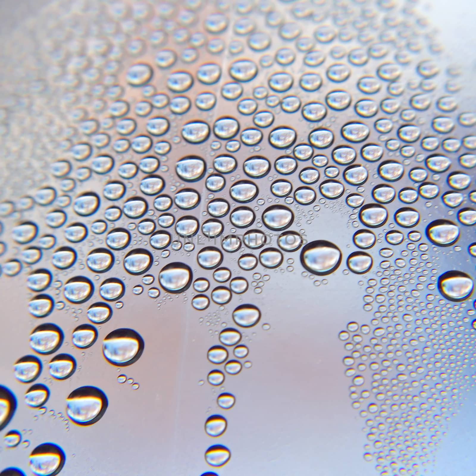 Drops of water on the crooked glass, shallow dof