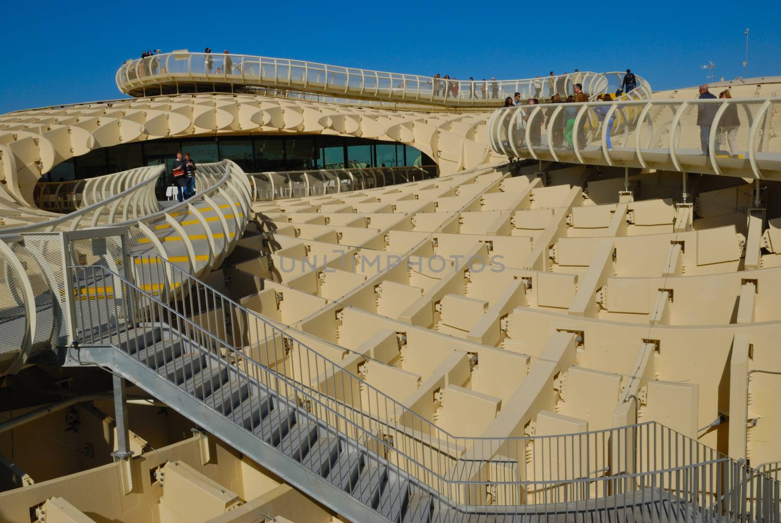 Metropol Parasol is a wooden building placed in La Encarnacion square, in the old quarter of Seville, Spain. It was designed by the German architect Jurgen Mayer-Hermann and completed in April 2011. The building is popularly known as Encarnacion's mushrooms.