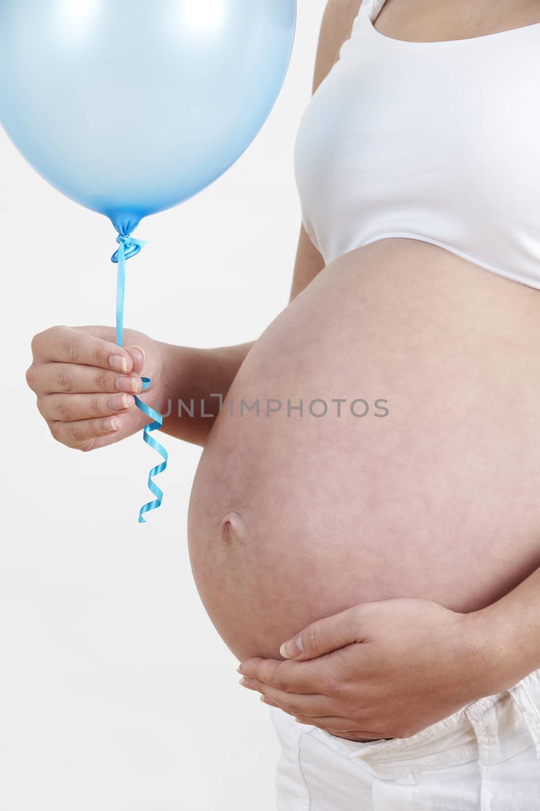 Close Up Of Pregnant Woman Holding Blue Balloon