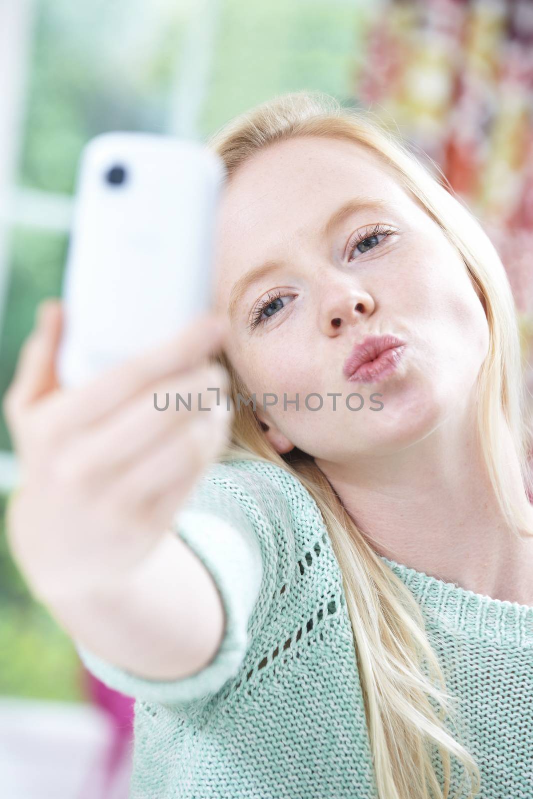 Teenage Girl Taking Selfie On Mobile Phone