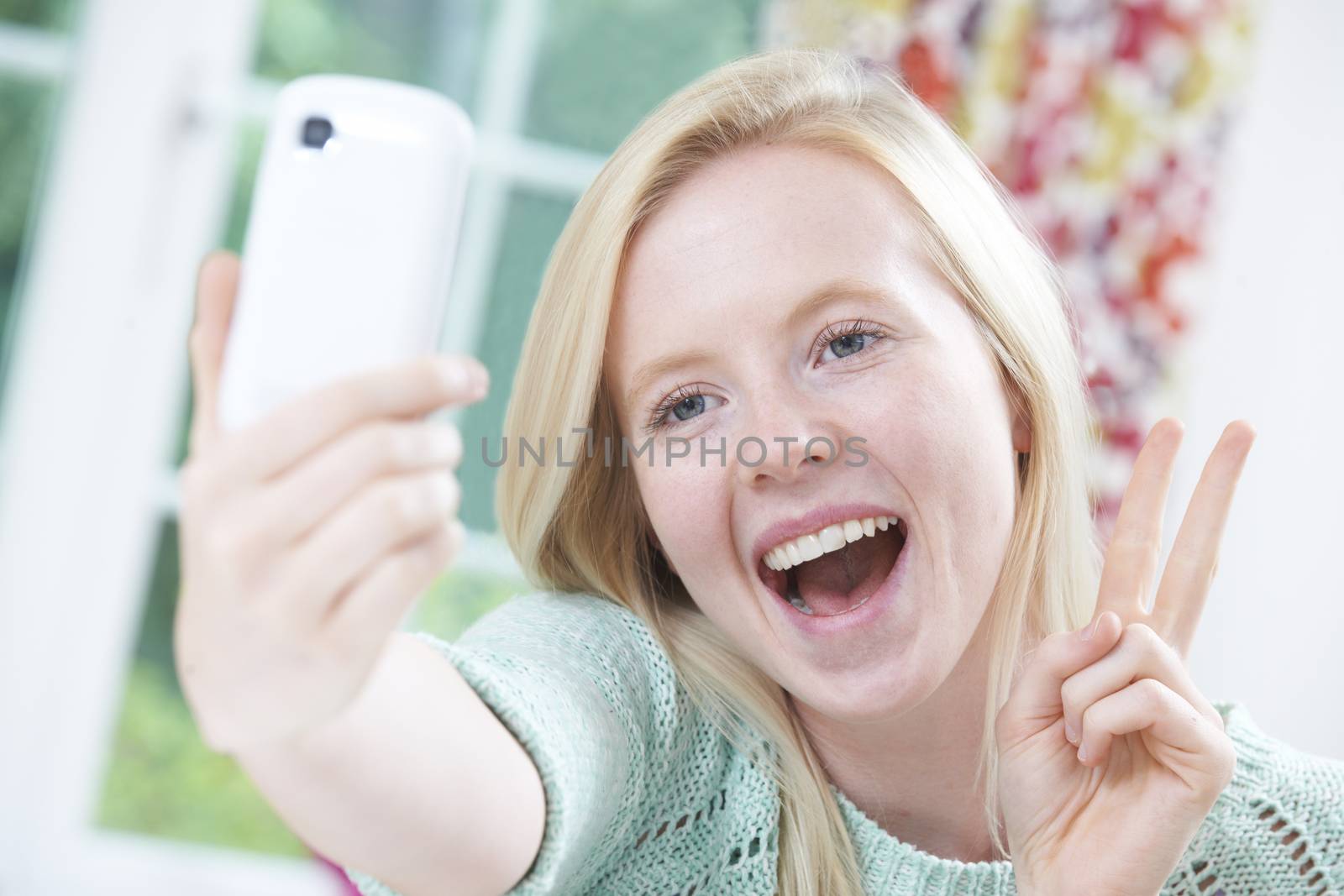 Teenage Girl Taking Selfie On Mobile Phone