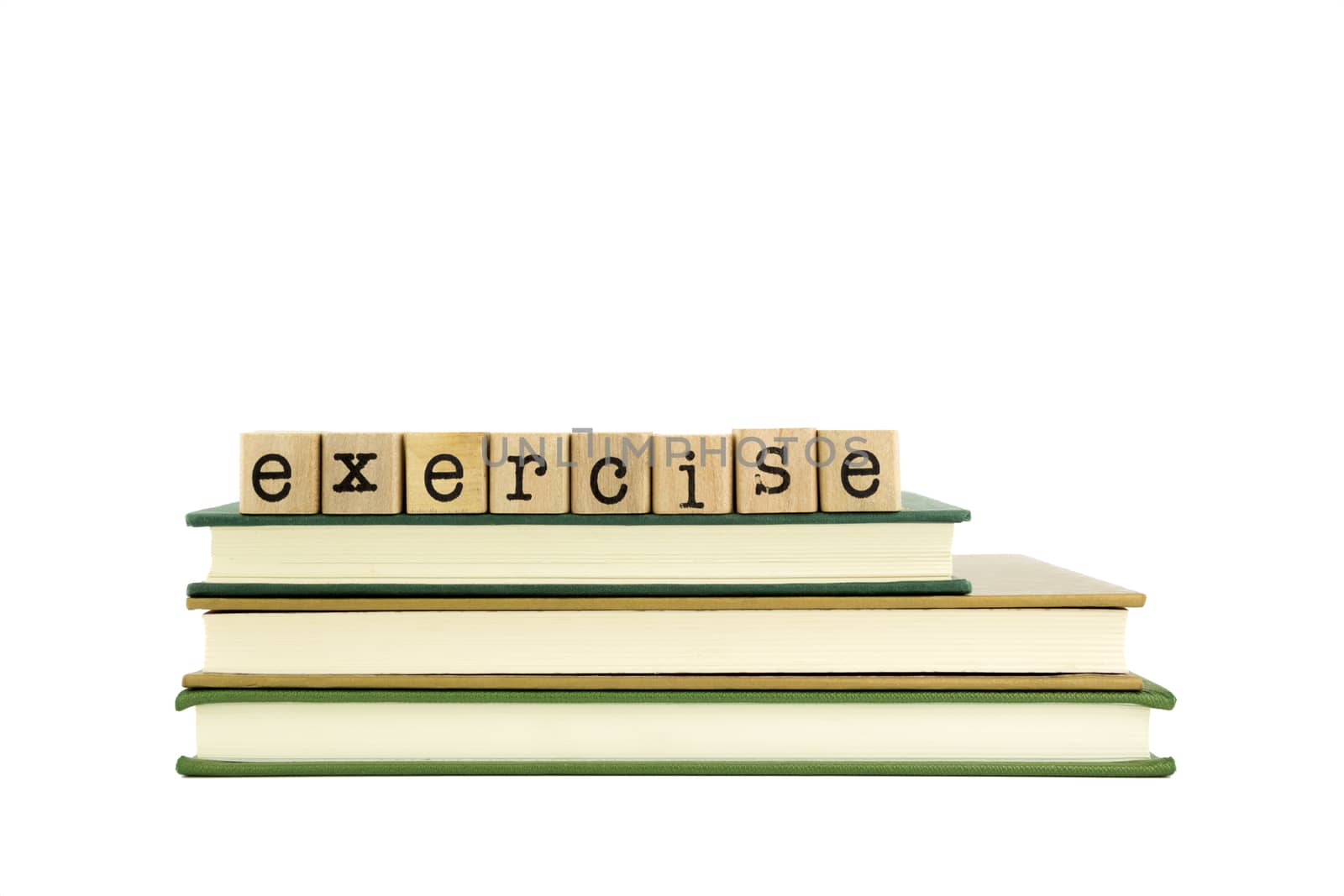 exercise word on wood stamps stack on books, homework and learning concept
