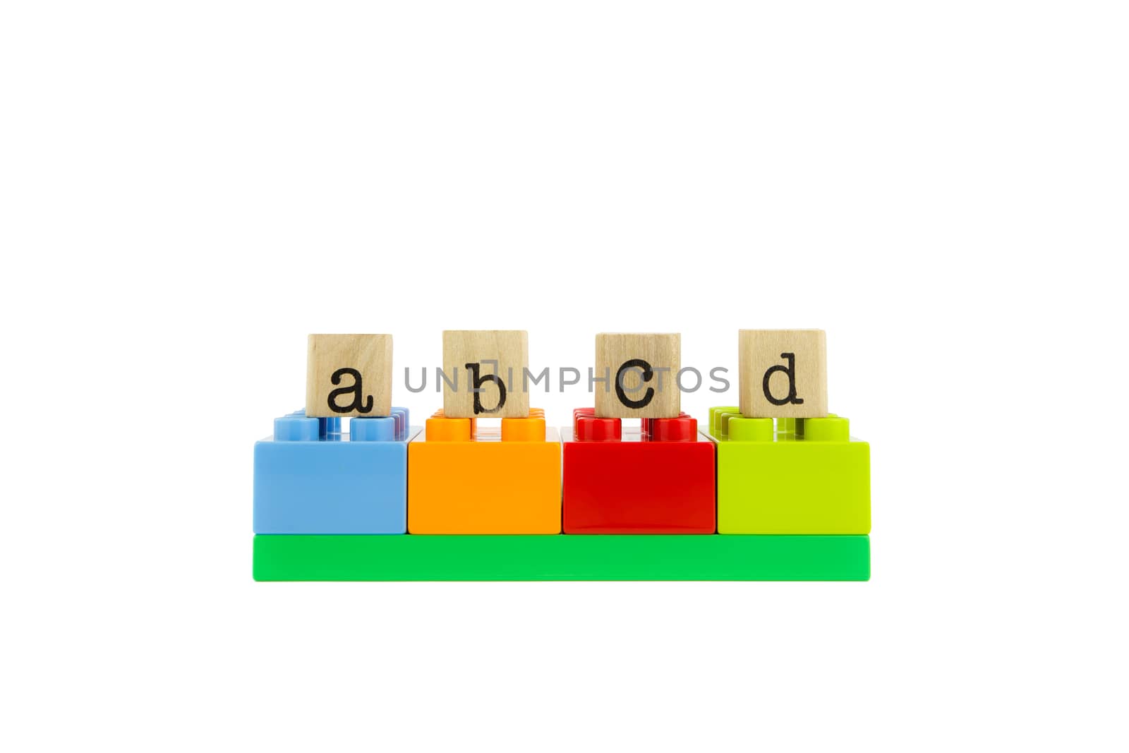 abcd word on wood stamps stack on colorful toy blocks, playing and learning language concepts