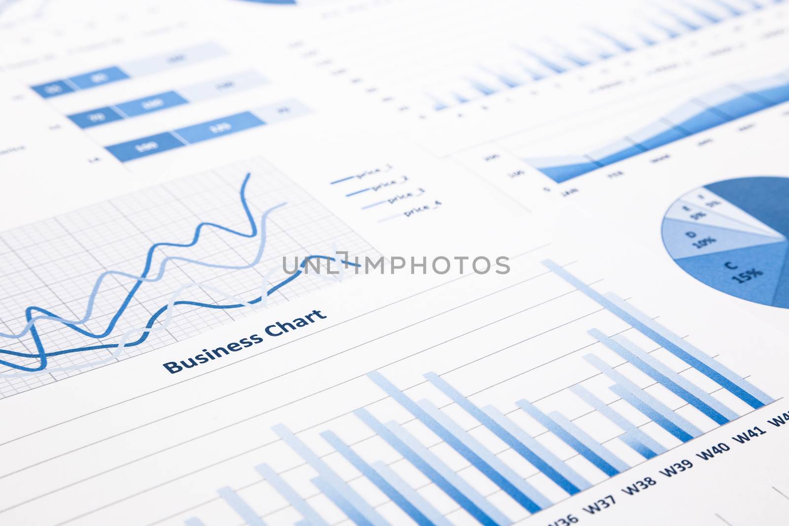 closeup blue business charts, graphs, statistic and reports for education and business concepts