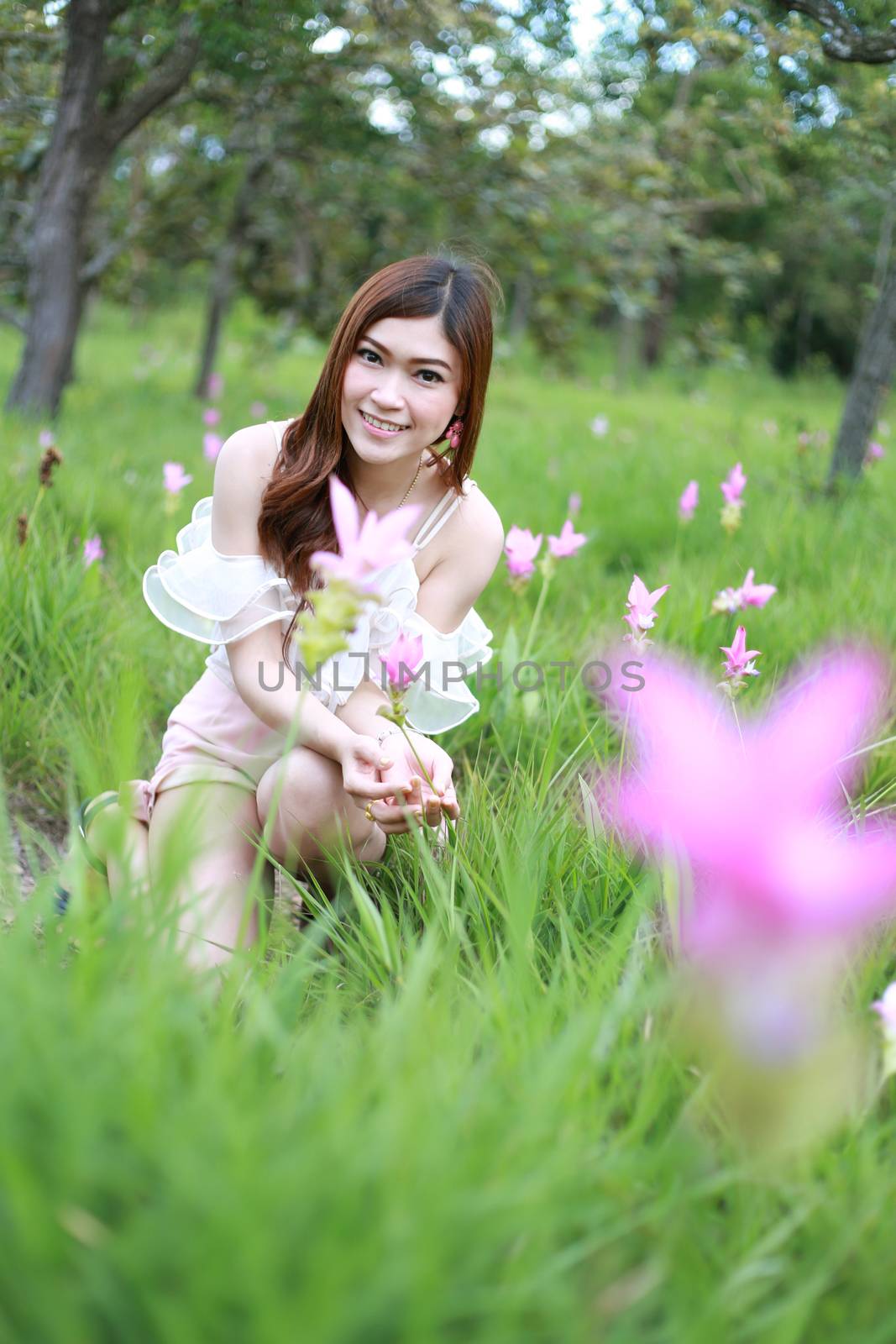 pretty asian woman in siam tulip flower field