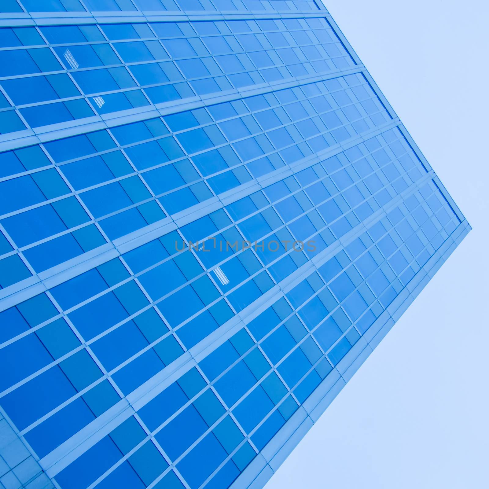 underside panoramic and perspective view to steel blue glass high rise building skyscrapers, business concept of successful industrial architecture