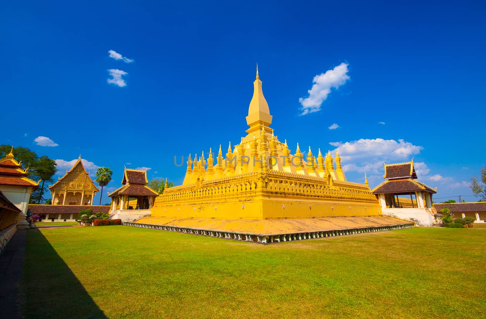 Pha That Luang, the golden stupa on the outskirts of Vientiane, Laos, that has become a national symbol for the nation. Photo taken during sunrise.