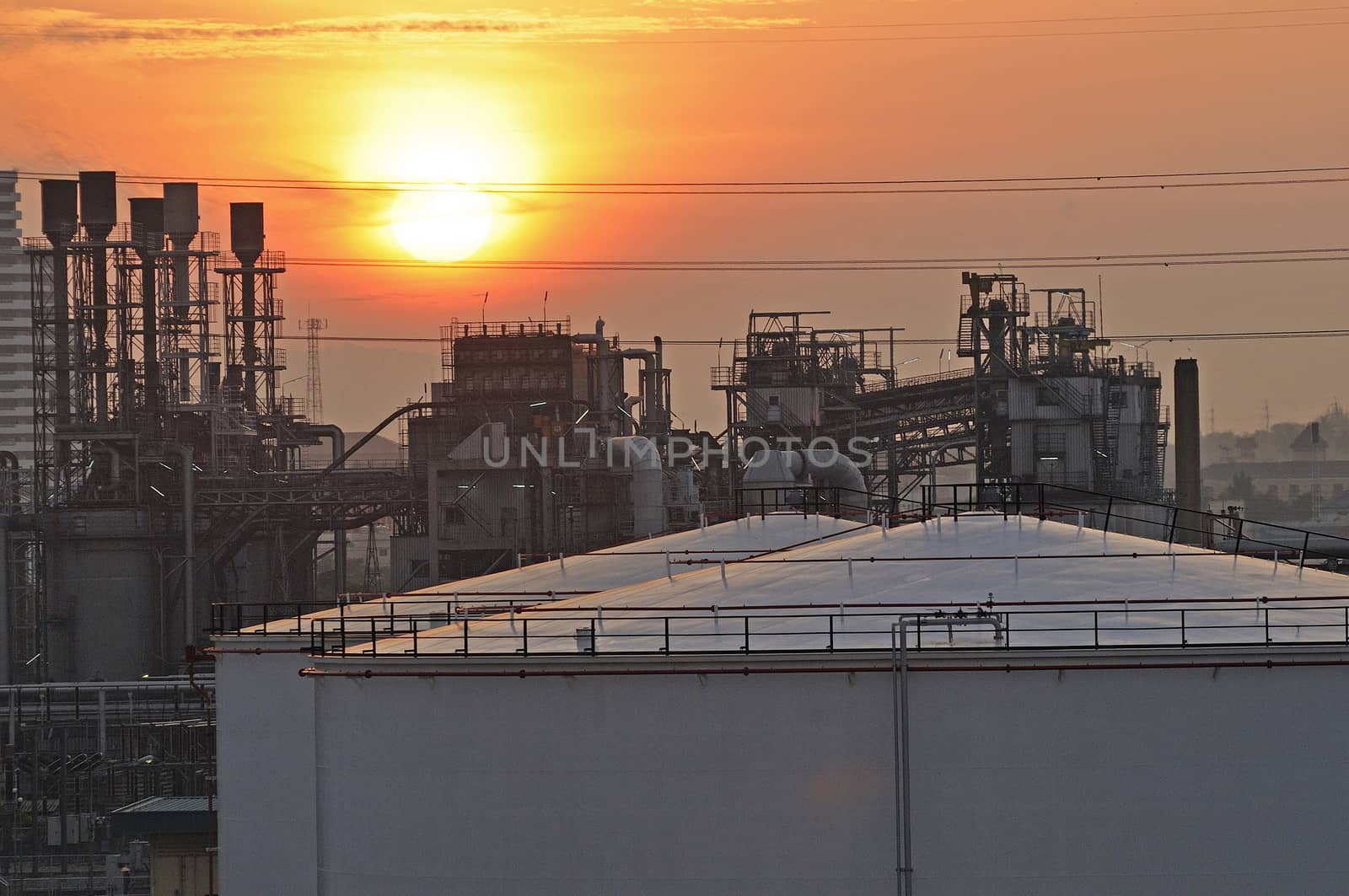 Oil Refinery factory at sunset by think4photop