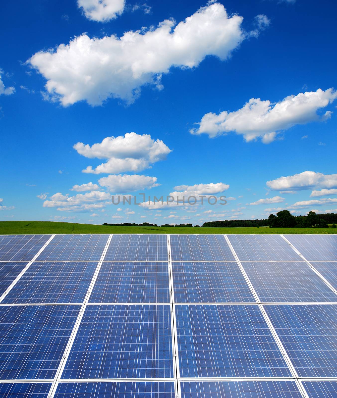 solar power plant under a blue sky, panels producing clean green electricity