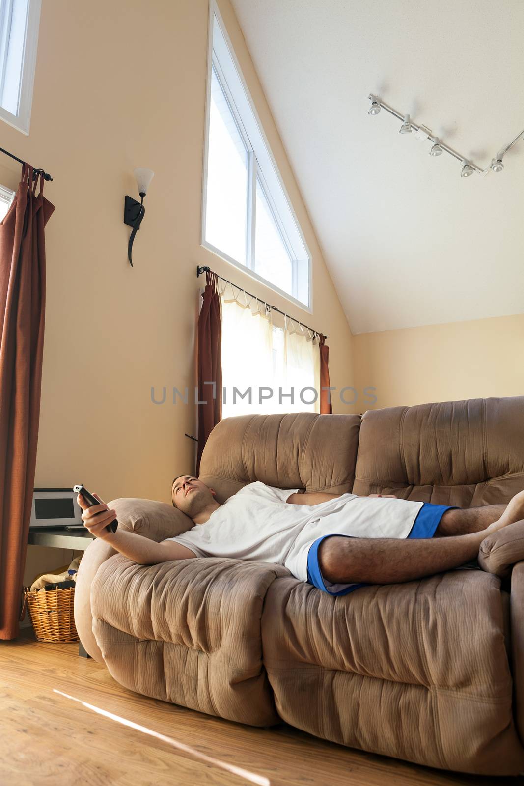 Lazy Man Laying on the Sofa by graficallyminded