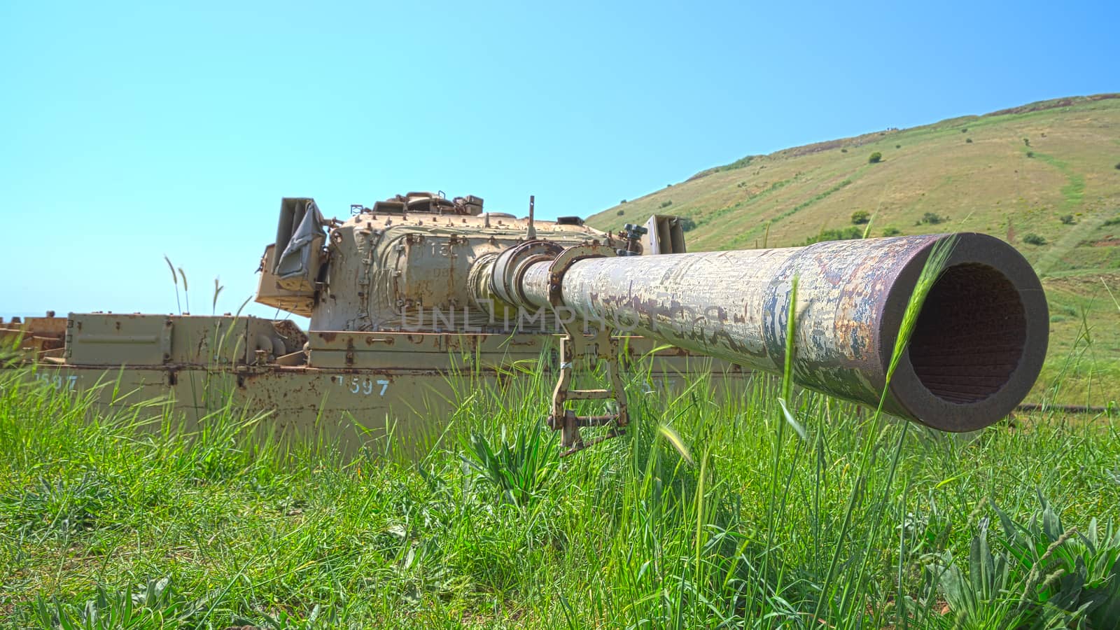 Rusty tank turret with large caliber cannon. HDR shot.