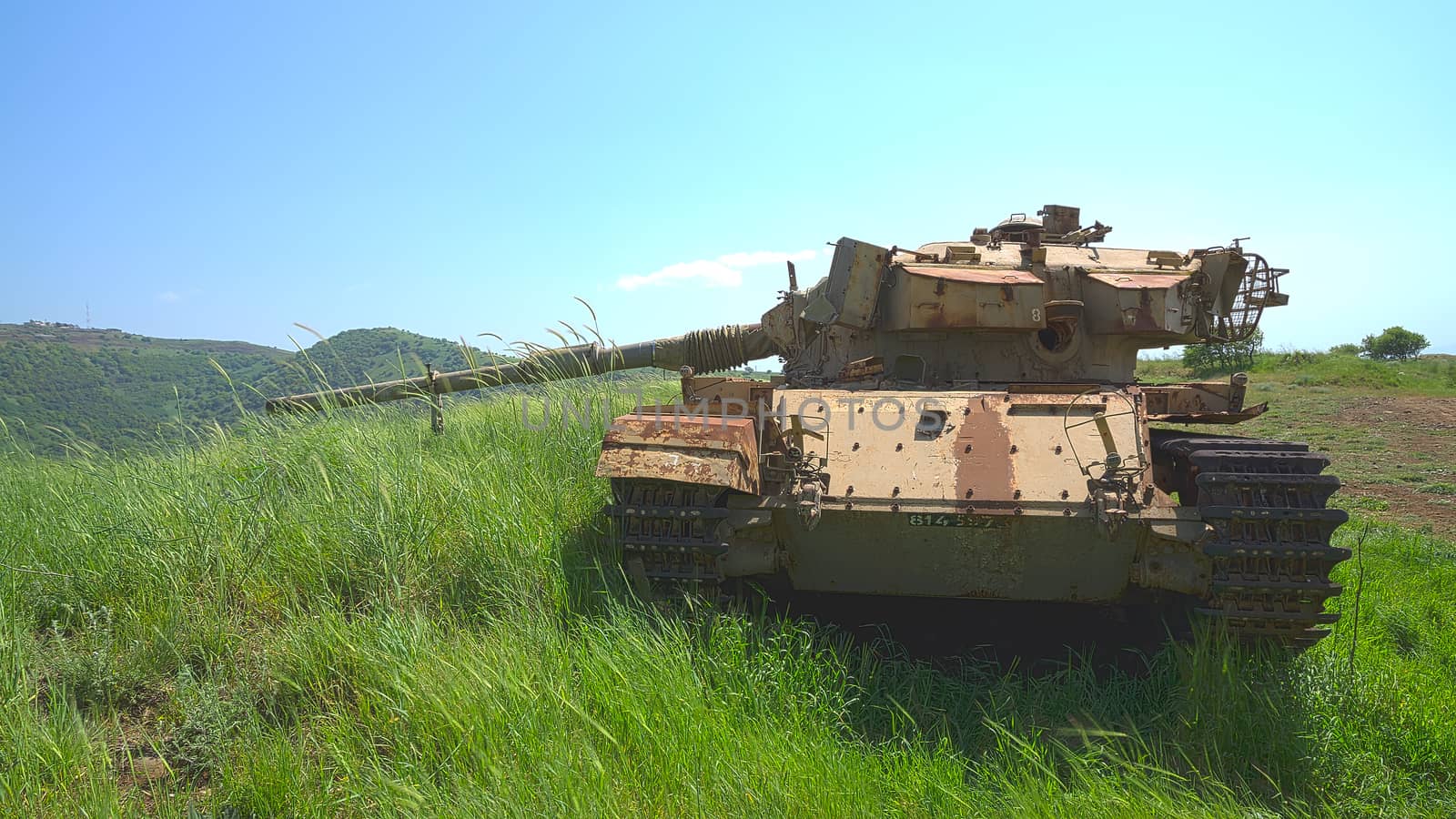 Destroyed rusty tank on battlefield near the Israeli Syrian border. HDR photo.